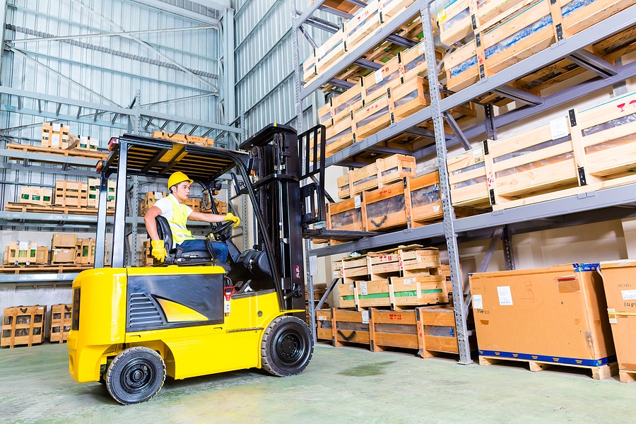 Forklift lifting pallets of inventory in an Indianapolis, IN warehouse